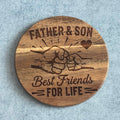 Wooden coaster with engraved design and text 'Best Friends For Life Father & Son' on a gray background